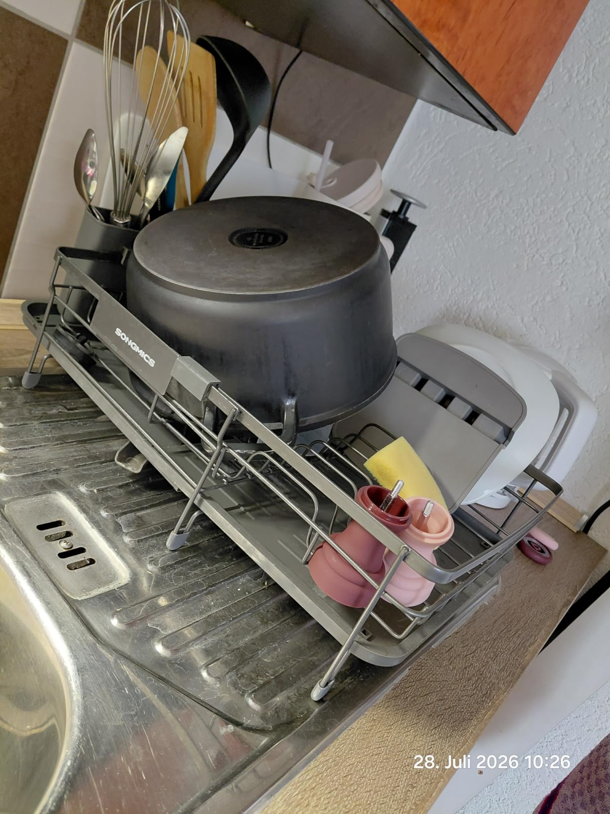 Passt sich der Spüle an